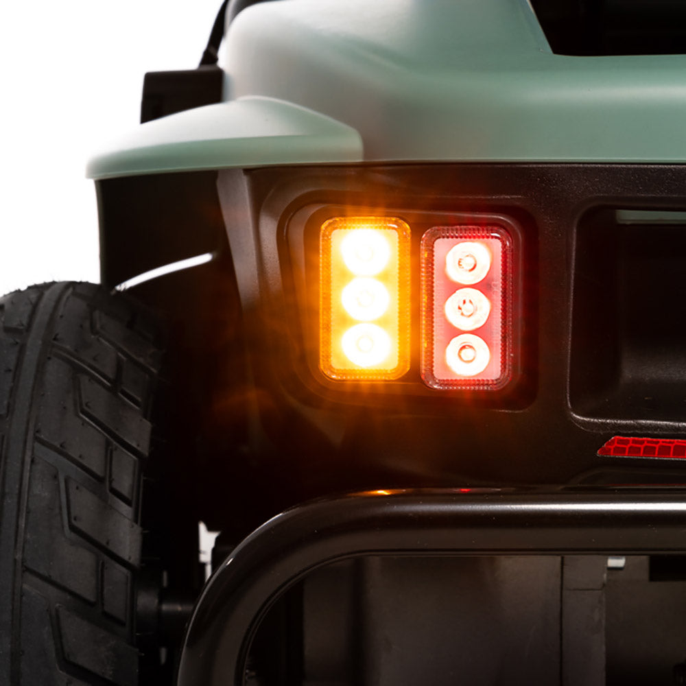 Close-up of rear LED lights and tire on Pride Mobility Baja Bandit scooter for enhanced safety