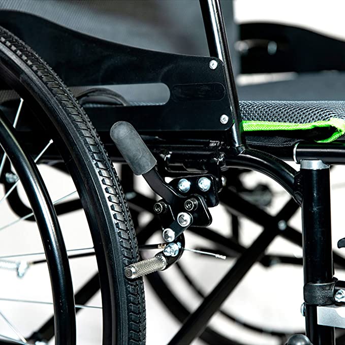 Close-up of Feather wheelchair brake and wheel assembly showing black frame and green-trimmed seat FEATHER CHAIR HD - 15 LBS