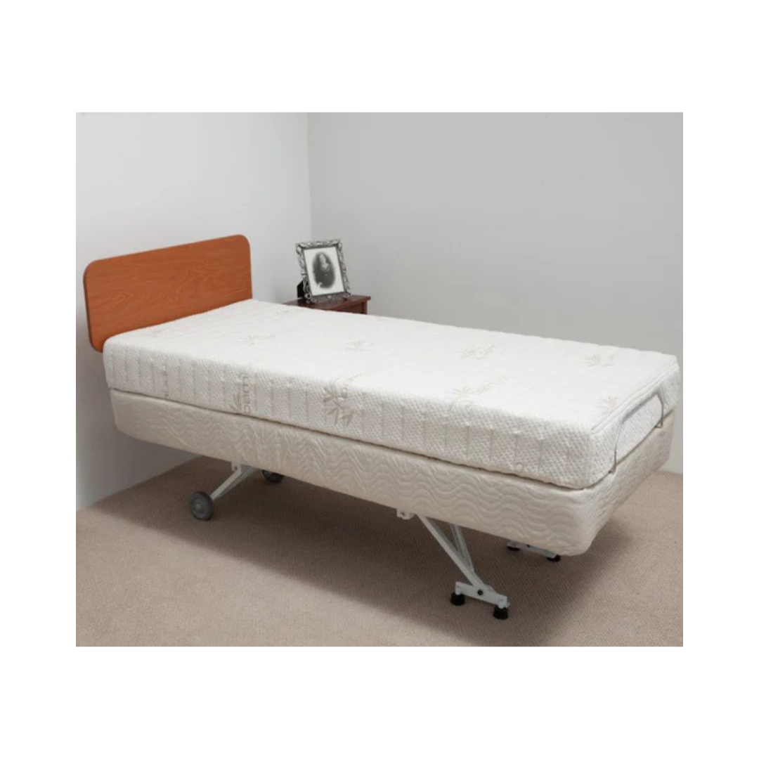 Transfer Master hospital bed with wooden footboard and adjustable metal frame on wheels