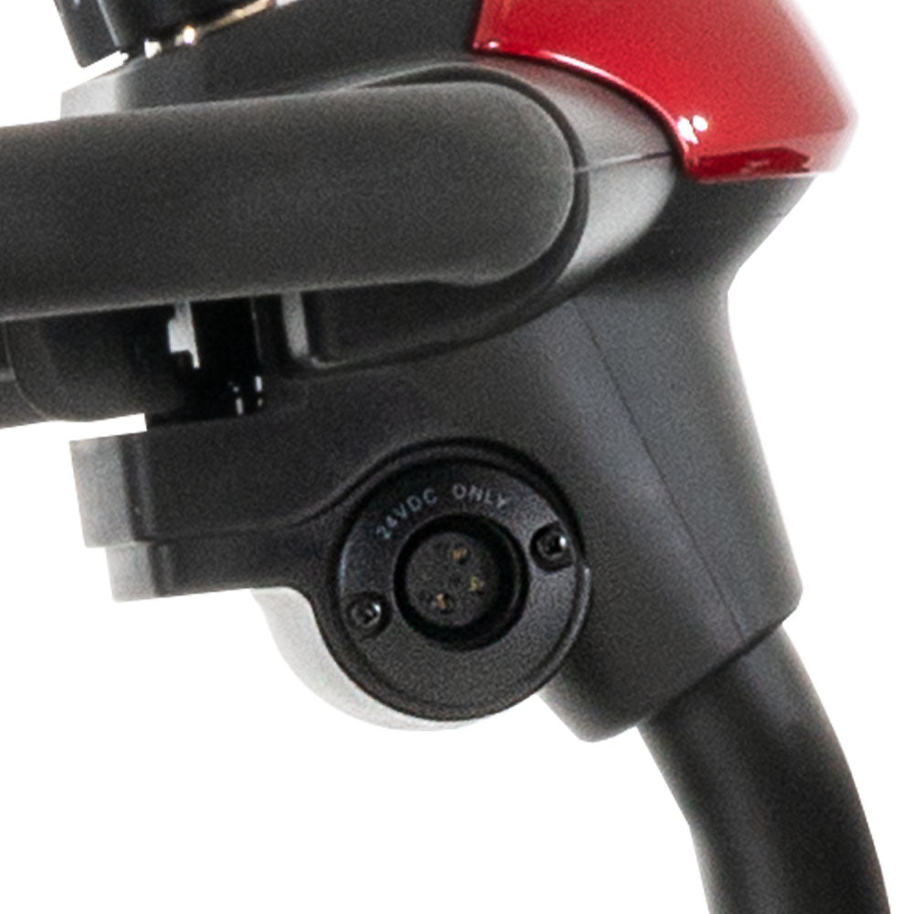 Close-up of charging port on Pride Mobility Go Go Elite Traveller 3-Wheel Mobility Scooter handlebar