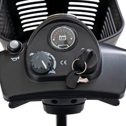 Control panel close-up of Pride Mobility Go Go Ultra X 3-Wheel Mobility Scooter with battery gauge and key