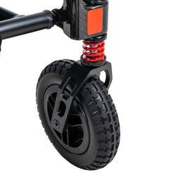 Close-up of front wheel and suspension spring of Pride Jazzy Carbon mobility scooter by Pride Mobility