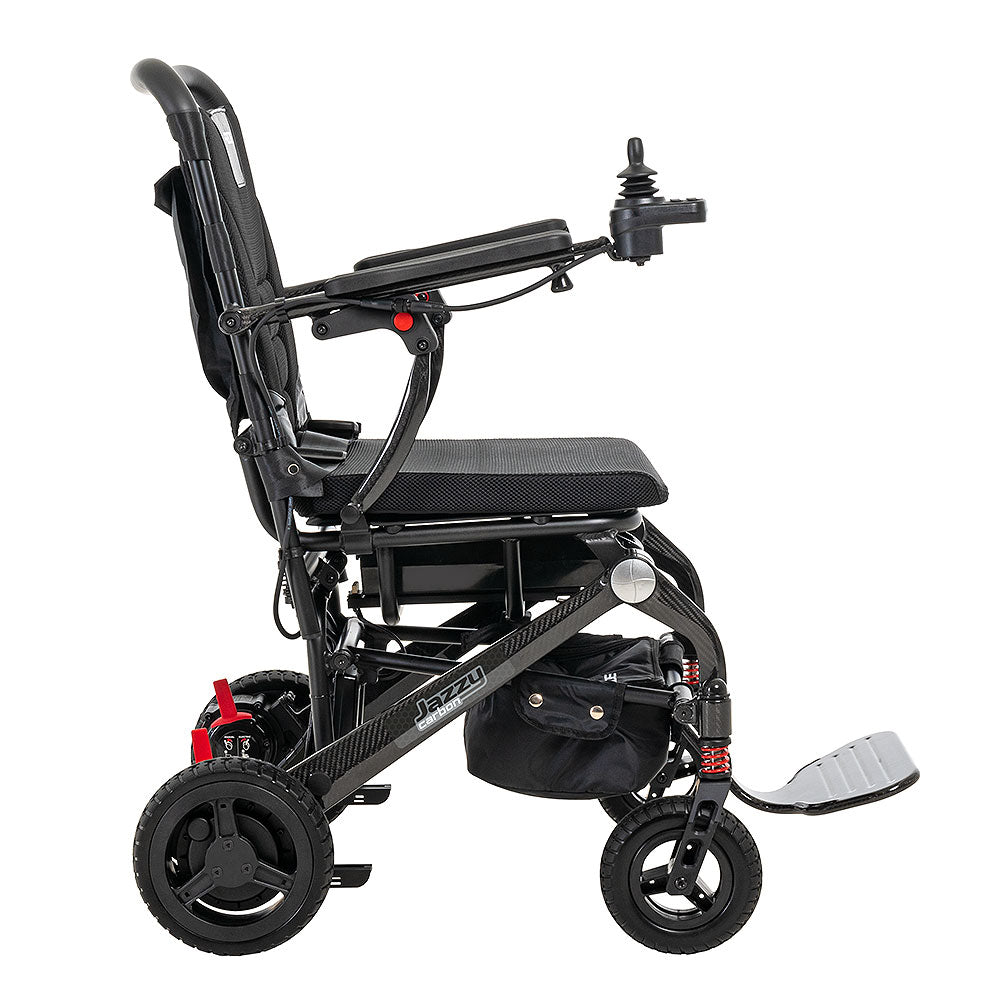 Side view of Pride Jazzy Carbon electric wheelchair in black with joystick control and padded seat