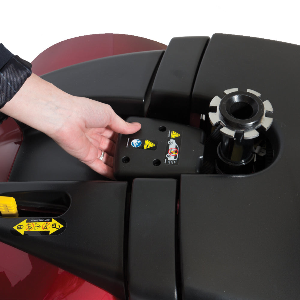 Person installing battery pack on Pride Mobility Victory 9 4 Wheel scooter close-up