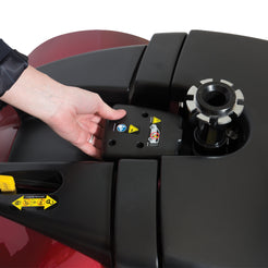 Person installing battery pack on Pride Mobility Victory 9 4 Wheel scooter close-up