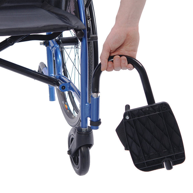 Close-up of footrest and front wheel on STRONGBACK 24AB Transport Wheelchair 1007AB with hand adjusting foot support