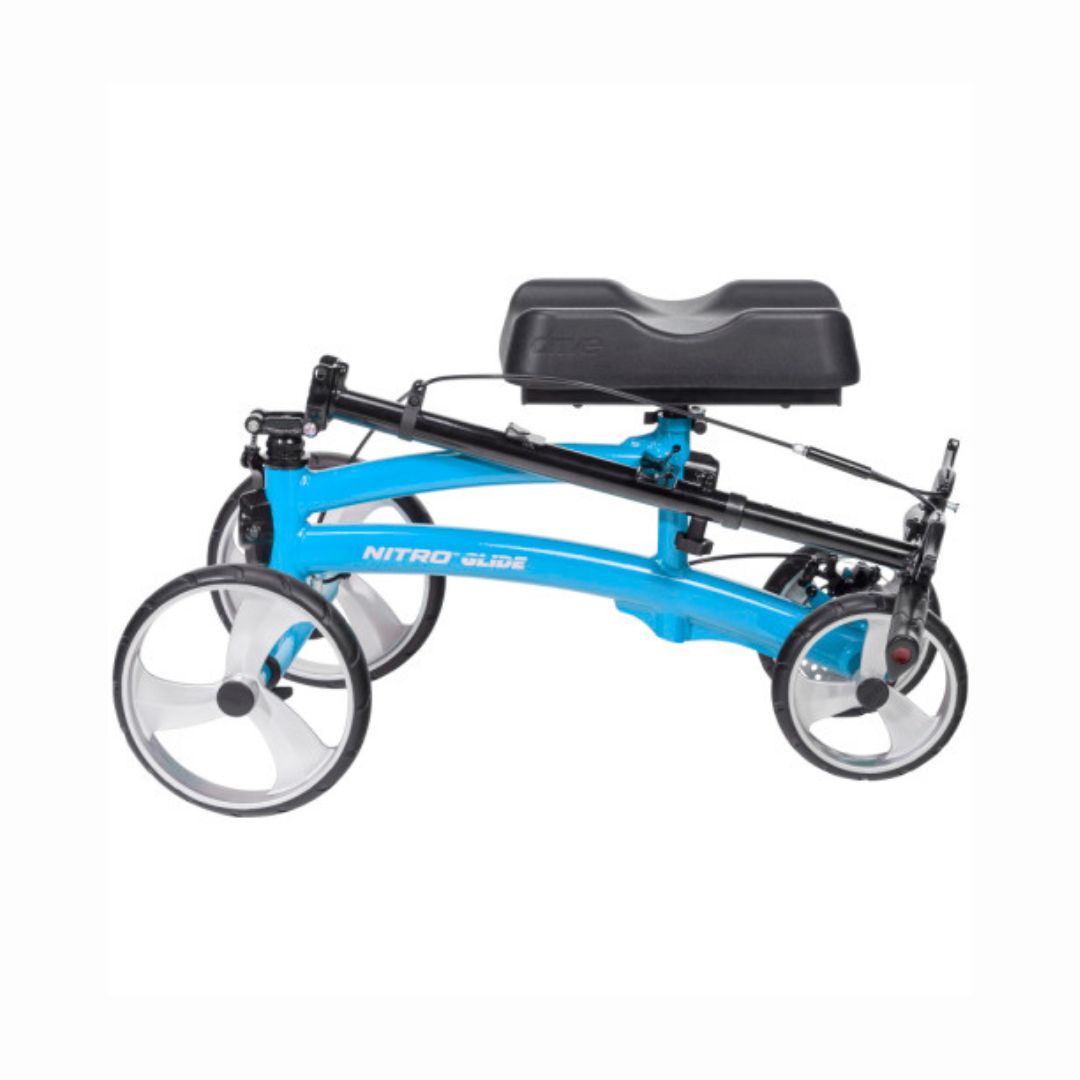Folded Nitro Glide Knee Walker in blue with black cushioned knee rest and large wheels