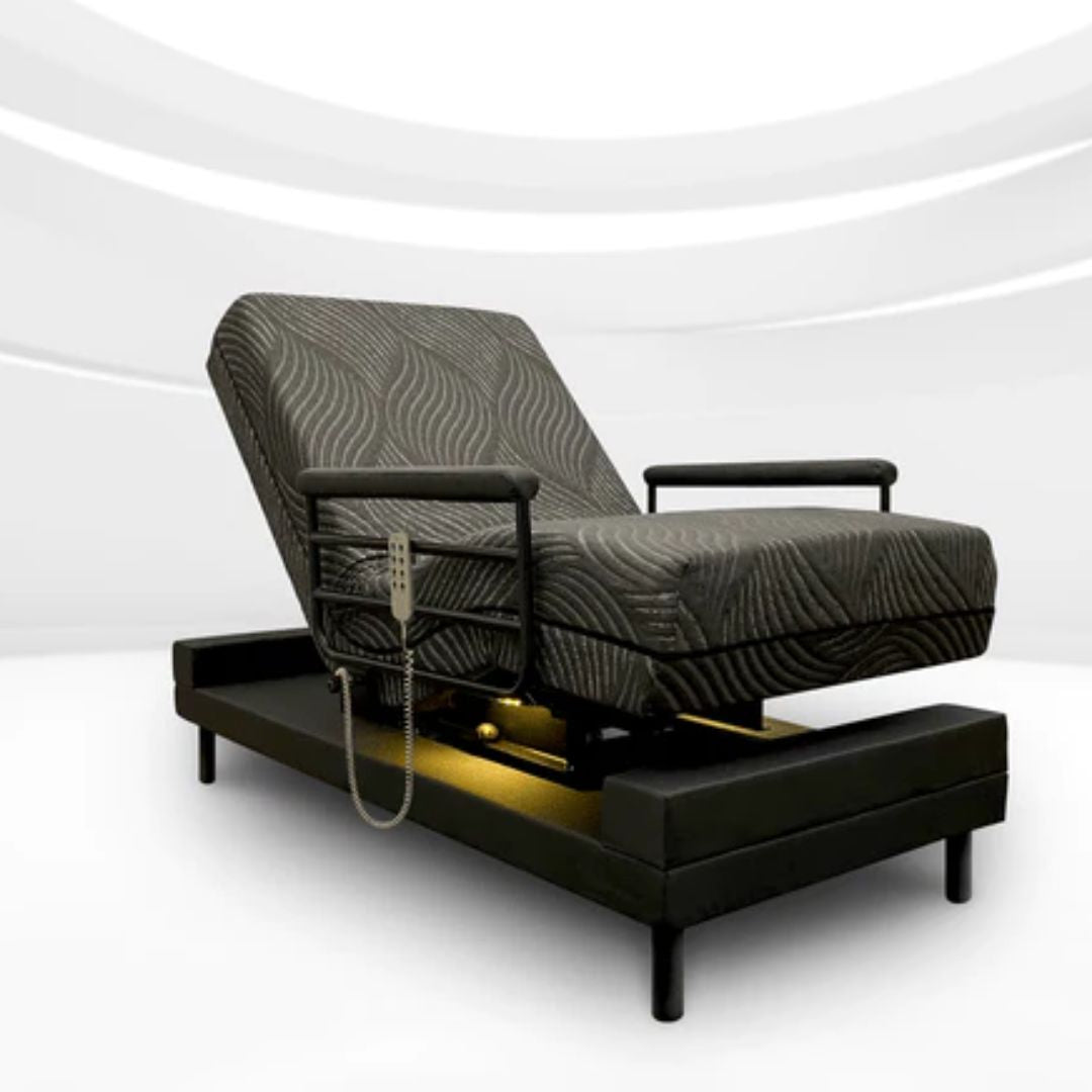 THE INDEPENDENCE BED adjustable electric reclining bed with black patterned mattress and armrests