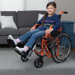 Ziggo Lightweight Pediatric Wheelchair for Kids & Children in bright orange with comfortable seating and adjustable footrests
