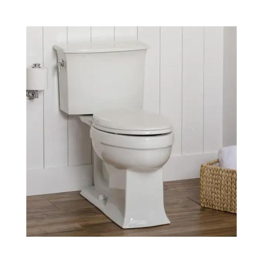 Bemis Clean Shield Raised Toilet Seat installed on a white toilet in a bathroom with wood floor