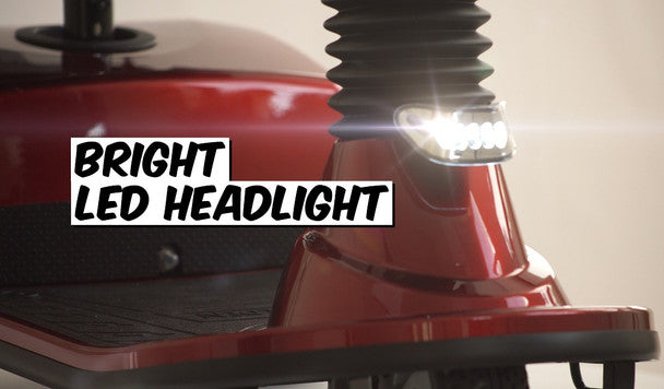 Close-up of bright LED headlight on GOLDEN TECHNOLOGIES Companion 3 wheel Mobility Scooter for enhanced visibility