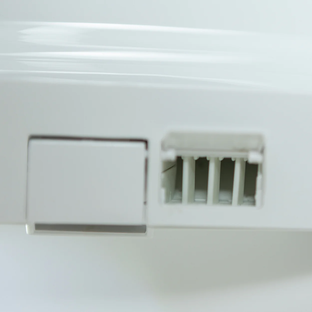 Close-up of the control panel on the DIGNITY LIFTS BIDET TOILET LIFT with ventilation slots