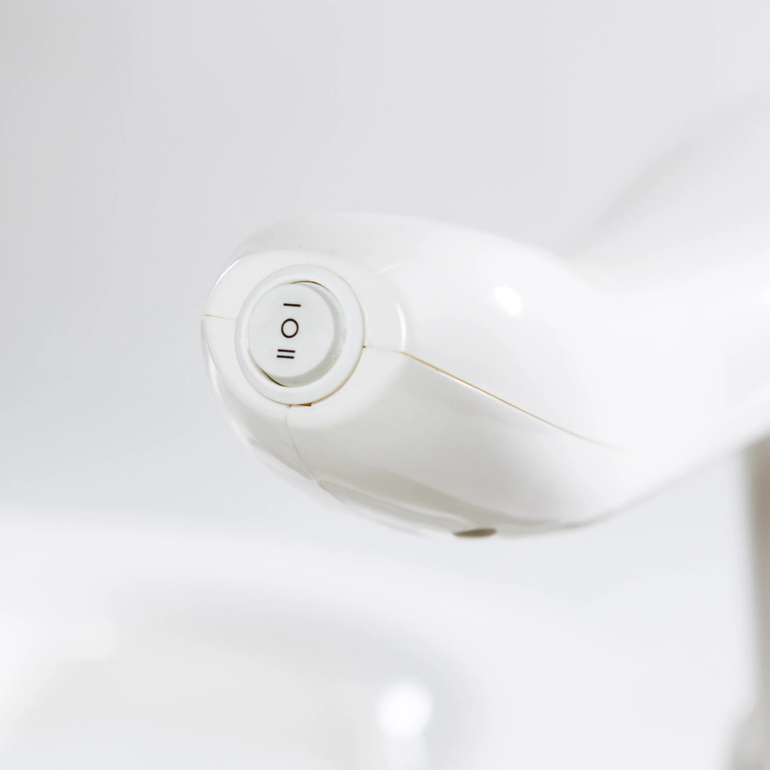 Control button on DIGNITY LIFTS DELUXE TOILET LIFT for easy adjustment and accessibility