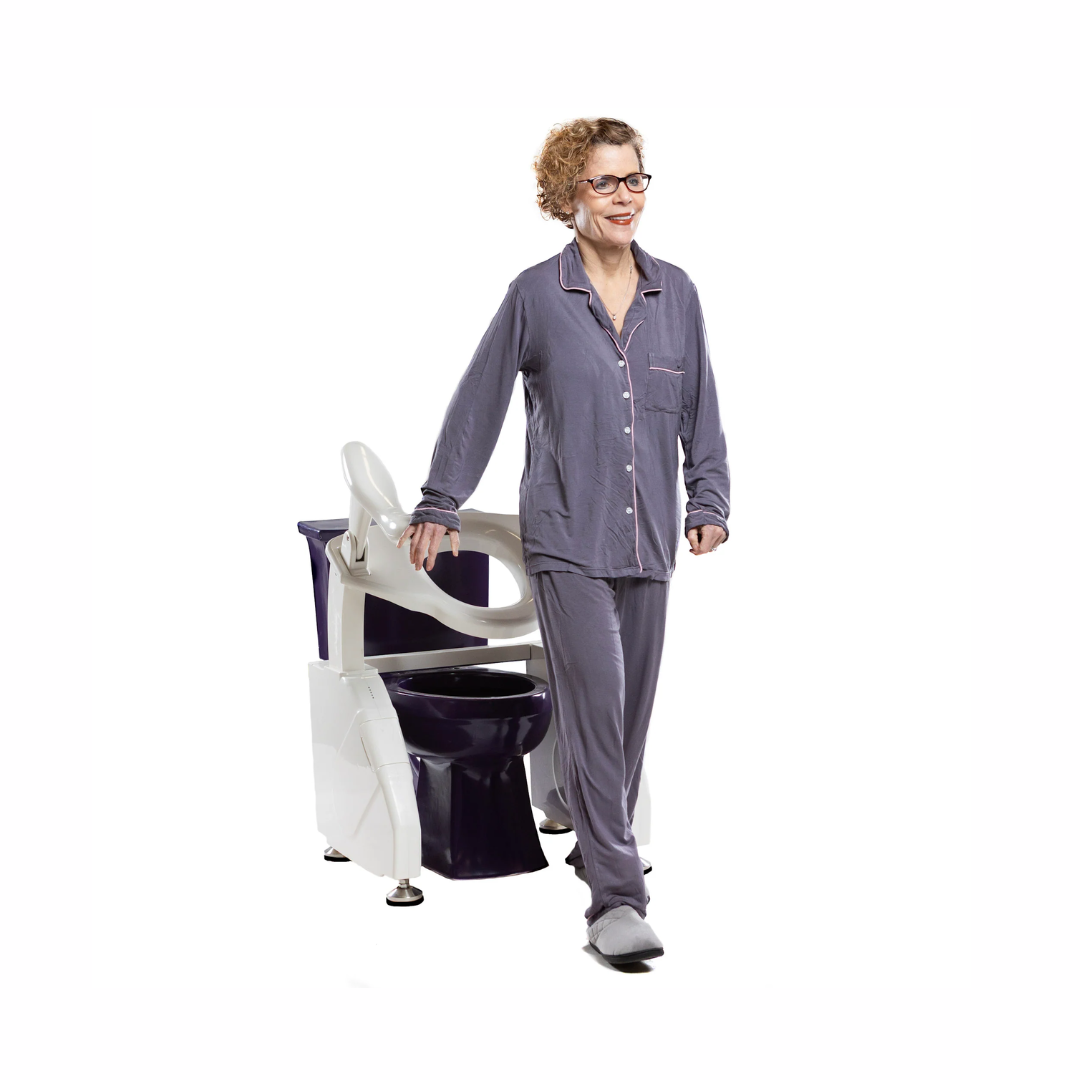 Dignity Lifts Deluxe Toilet Lift assisting a woman in pajamas for easy and comfortable use