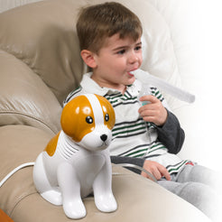 Beagle Pediatric Compressor Nebulizer by Drive Medical toy dog design with young boy using mouthpiece on couch