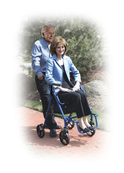 Drive Medical Duet Rollator Transport Chair 795BK in blue with rider being pushed on a path