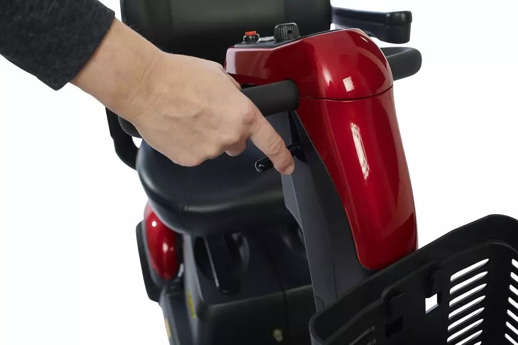 Close-up of the control panel on the Buzzaround LX Luxury 3 Wheel Mobility Scooter with a hand activating the controls