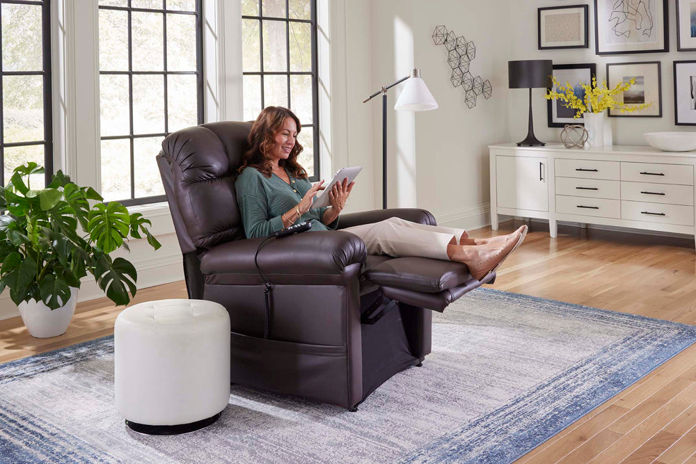 Golden Technologies Cloud Power Lift Chair Recliner PR510-SME in brown with a woman using a tablet