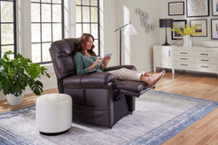 Golden Technologies Cloud Power Lift Chair Recliner PR510-SME in brown with a woman using a tablet