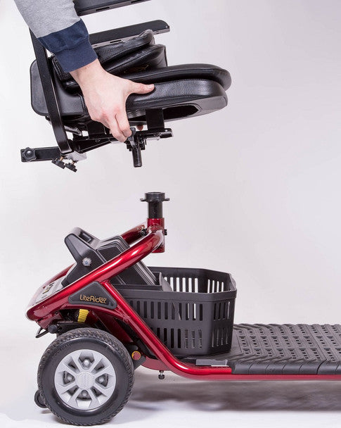 GOLDEN TECHNOLOGIES LiteRider 4 Wheel Mobility Scooter in red being assembled with a black seat