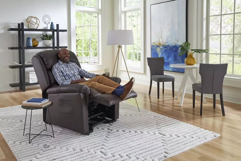 GOLDEN TECHNOLOGIES Relaxer power lift chair recliner PR766 in dark gray with a man relaxing