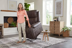 GOLDEN TECHNOLOGIES Titan Medium Lift Recliners PR448-MED in brown with woman using the lift feature