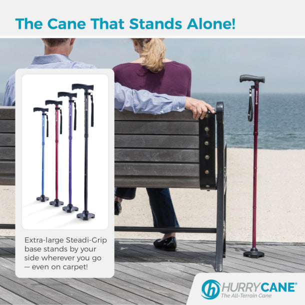 Drive Medical HurryCane Freedom Edition Folding Cane in purple on a beachside bench
