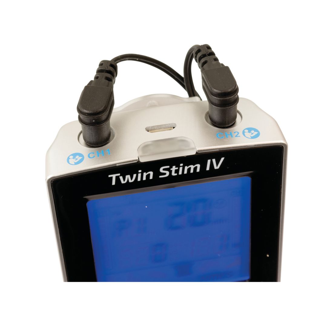 InTENSity Twin Stim IV Tens Unit close up with two electrode leads plugged into CH1 CH2 and blue LCD display