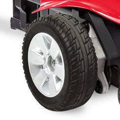 Close-up of rear tire on Pride Jazzy Elite ES Compact Power Chair showcasing tread and wheel design