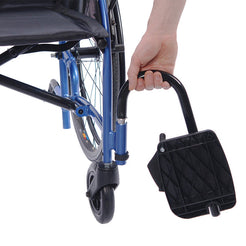 Close-up of footrest and front wheel on STRONGBACK 22S Transport Wheelchair 1017 in blue with hand adjusting footrest