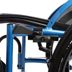 STRONGBACK 24 Flip Wheelchair 1019 close up of blue frame with manual brake lever rear wheel and mesh seat back