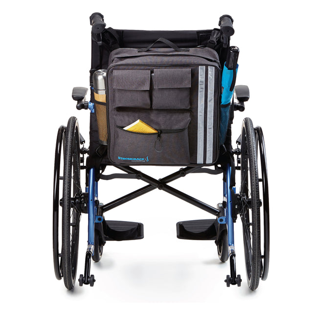 StrongBack Mobility Wheelchair Backpack on wheelchair back with front pockets reflective stripe and side bottle pocket
