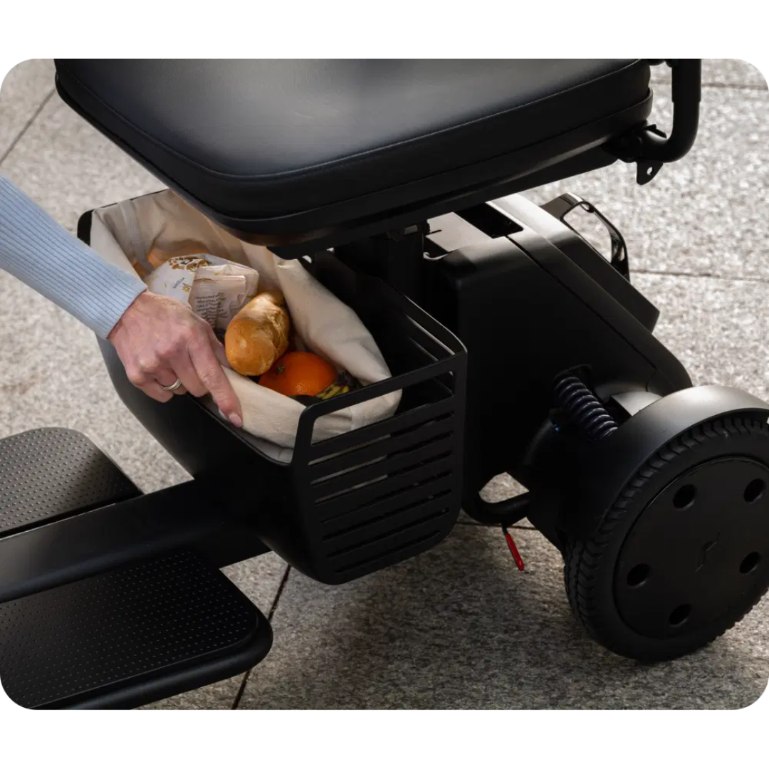 WHILL Model R Urban 4 Wheel Mobility Scooter with storage basket for groceries
