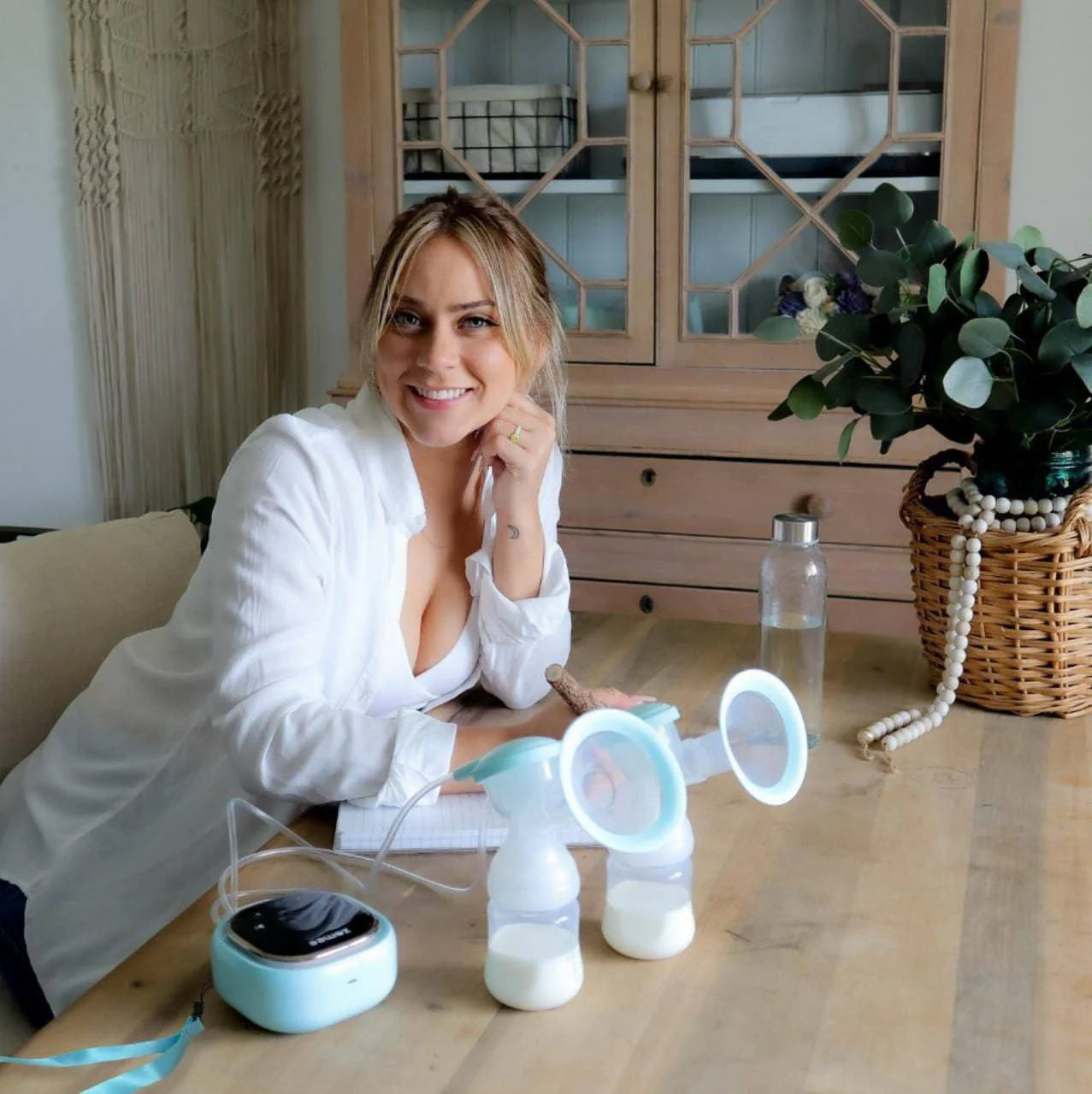 Z2 Double Electric Breast Pump by Zomee with two bottles and pump unit on a table