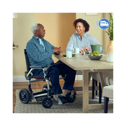 Journey Health & Lifestyle Zoomer Electric Power Mobility Folding Chair in action with users at a table